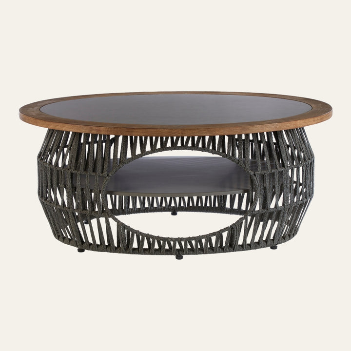 Eravaya Woven Rope Coffee Table with round wood-rim top and dark inset, open woven charcoal rope base with circular cutout and lower shelf