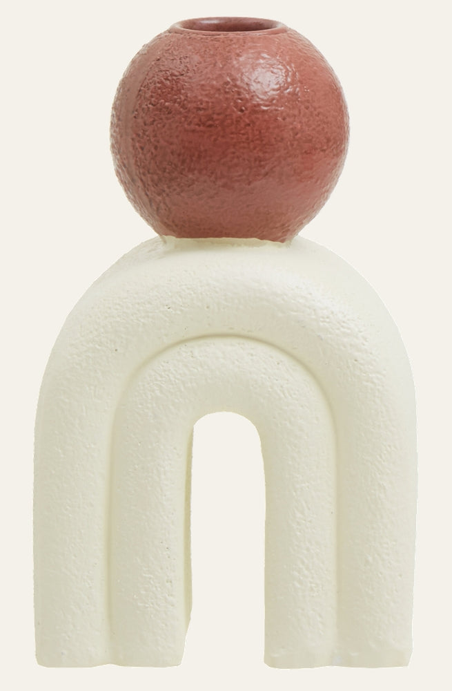 Eriya Candle Holder with a cream textured arch-shaped base topped by a rust-red textured spherical candle cup