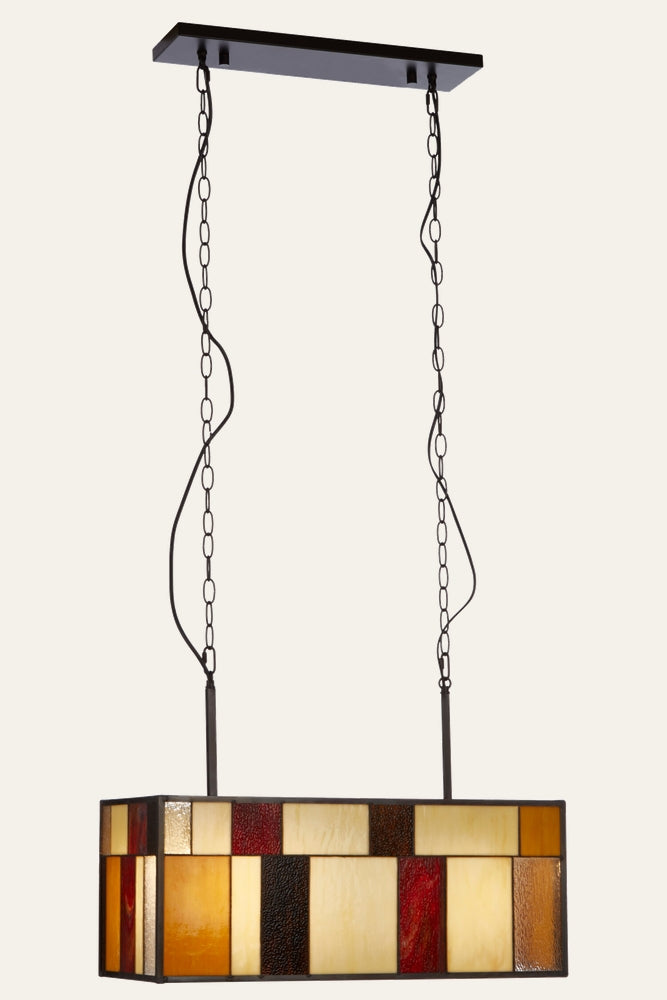 Evaya Ceiling Light — rectangular stained-glass pendant shade with amber, cream, red, and brown glass panels in a dark metal frame, suspended by two chains and cords from a rectangular ceiling canopy.