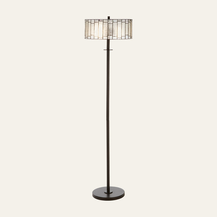Evaya Open Frame Floor Lamp — dark bronze metal base and slim pole with a decorative stained-glass drum shade featuring rectangular textured glass panels and metal leading.