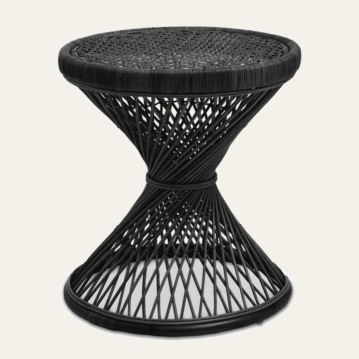 Evena Rattan Side Table — black woven rattan hourglass side table with round woven top and crisscross open-weave base.
