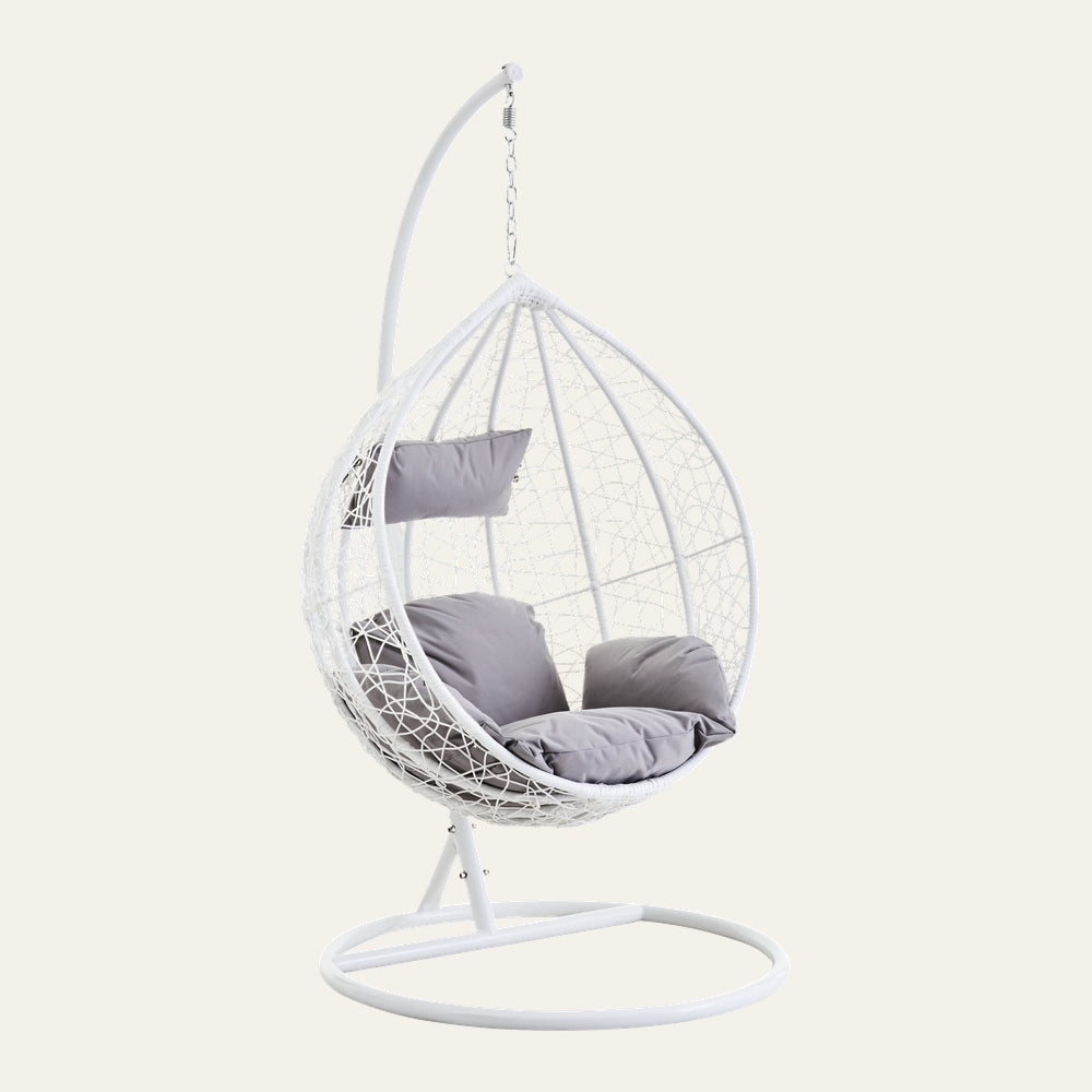 Evira Rattan Effect Hanging Chair — white woven rattan-effect egg-shaped hanging chair on a white metal stand with light grey seat and back cushions