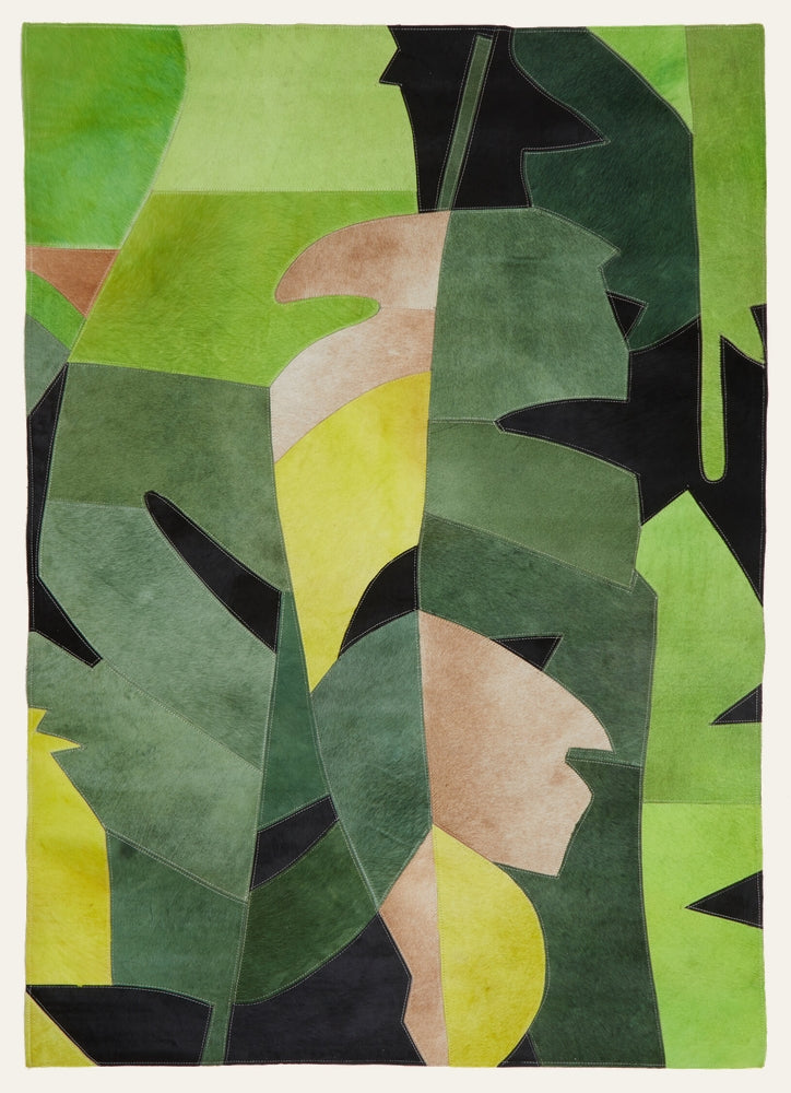 Ezelle Botanical Leather Rug — patchwork leather rug with botanical leaf shapes in shades of green, yellow, beige and black, hair-on-hide texture.