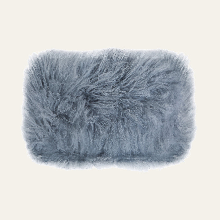 Ezelle Cushion — rectangular blue-gray cushion with long curly shag fur texture
