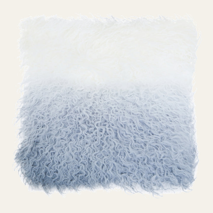 Ezelle Cushion — square shaggy long-curly faux-fur cushion with a white-to-light-blue ombré