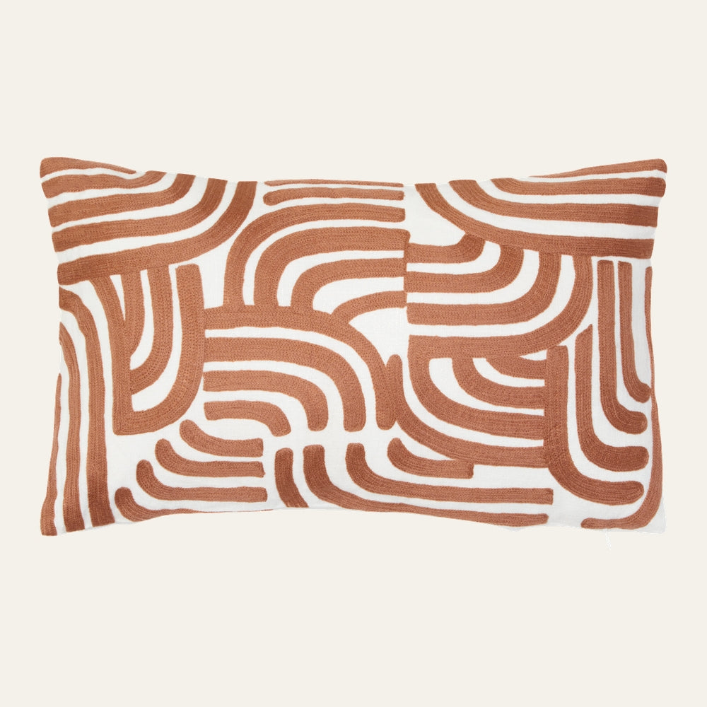 Ezelle Cushion | Ozella Cushion — rectangular lumbar pillow with white cover and raised terracotta curved geometric tufted pattern