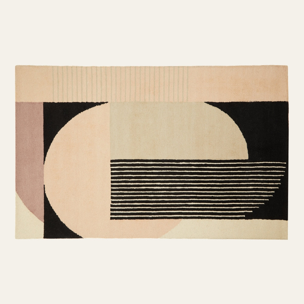 Ezelle Geometric Fabric Rug with pastel pink, beige, cream and black geometric pattern of semicircles, rectangular blocks and stacked horizontal stripes
