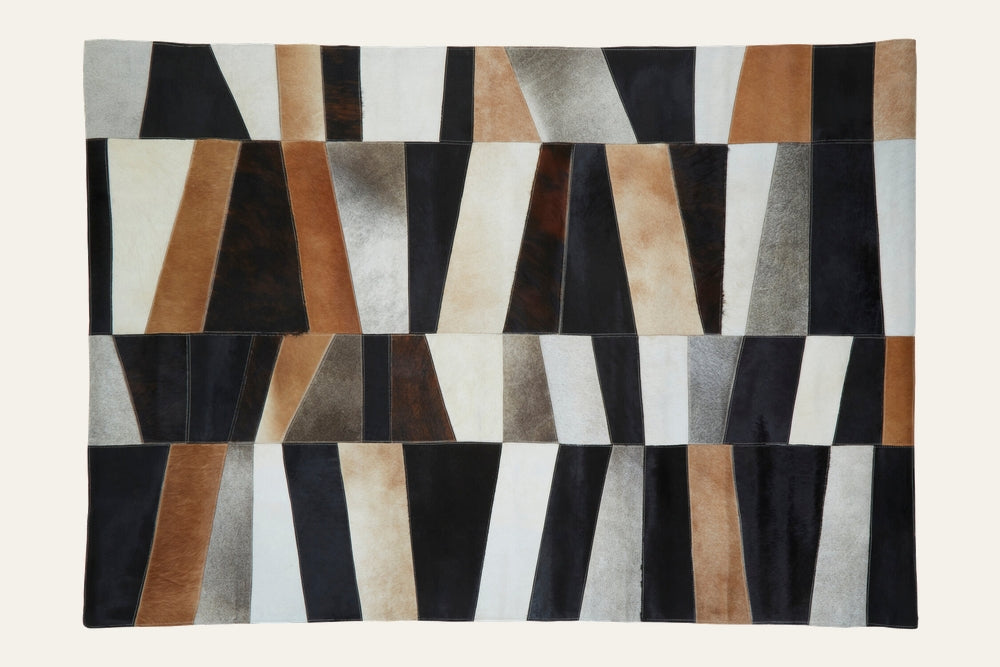 Ezelle Geometric Leather Rug, rectangular patchwork of stitched geometric leather panels in black, brown, tan, cream, and gray