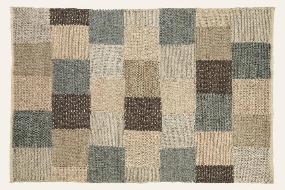 Ezelle Grid Design Rug, rectangular textured woven patchwork in a grid of beige, tan, gray, blue-gray, and brown rectangular blocks