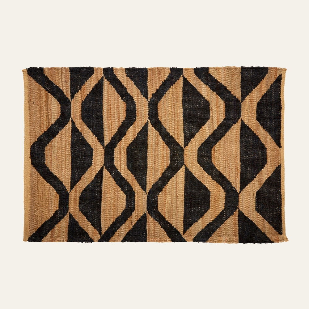 Ezelle Hemp Large Rug — rectangular woven hemp rug in natural tan with bold black geometric diamond-and-wave pattern