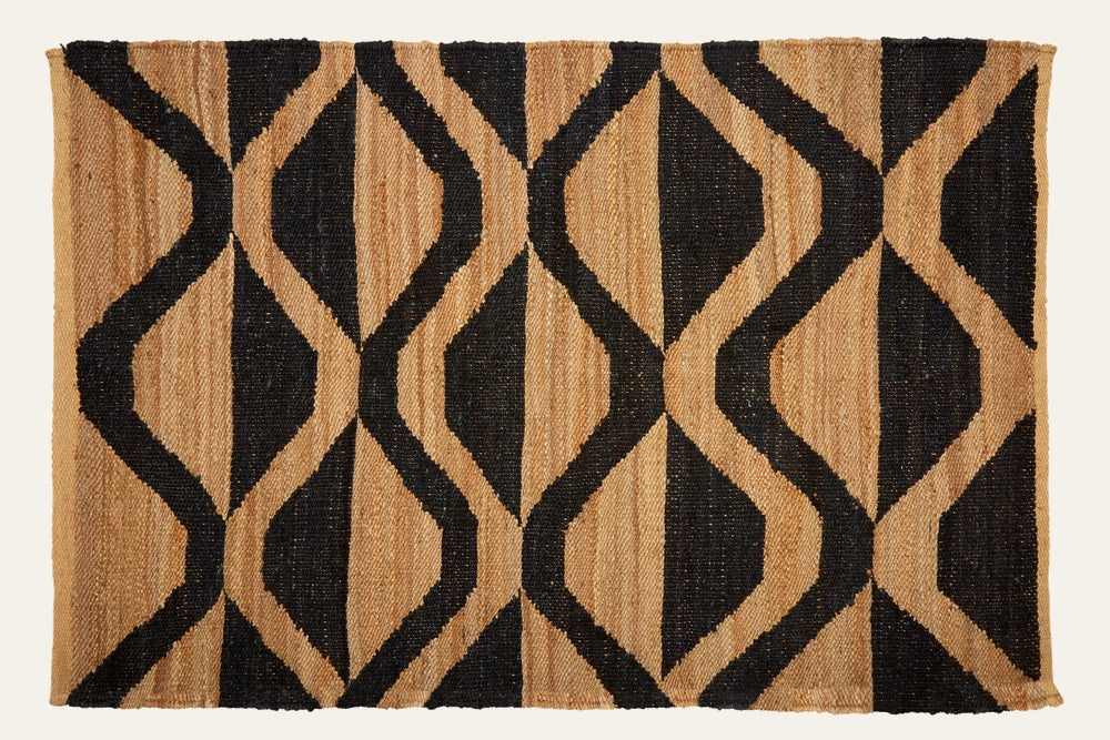 Ezelle Hemp Large Rug with natural tan hemp and bold black interlocking diamond geometric pattern, woven rectangular rug.
