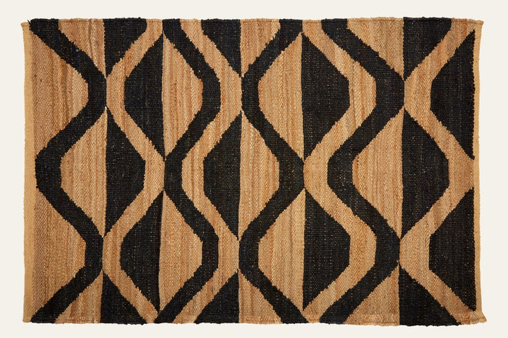 Ezelle Hemp Large Rug with natural tan hemp and bold black interlocking diamond geometric pattern, woven rectangular rug.