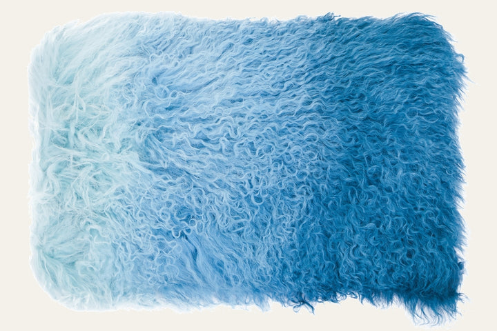Ezelle Rectangular Cushion with shaggy curly fur-like long-pile cover in an ombre blue gradient from pale aqua to deep teal