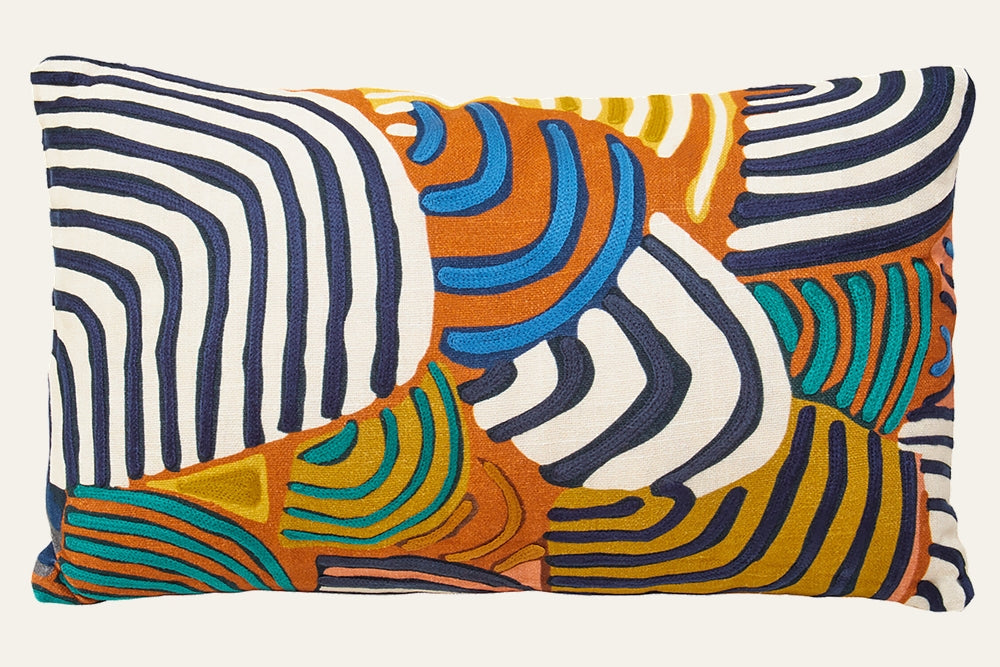 Ezelle Rectangular Fabric Cushion featuring textured fabric cover with embroidered abstract wavy stripes in navy, white, orange, teal and mustard.