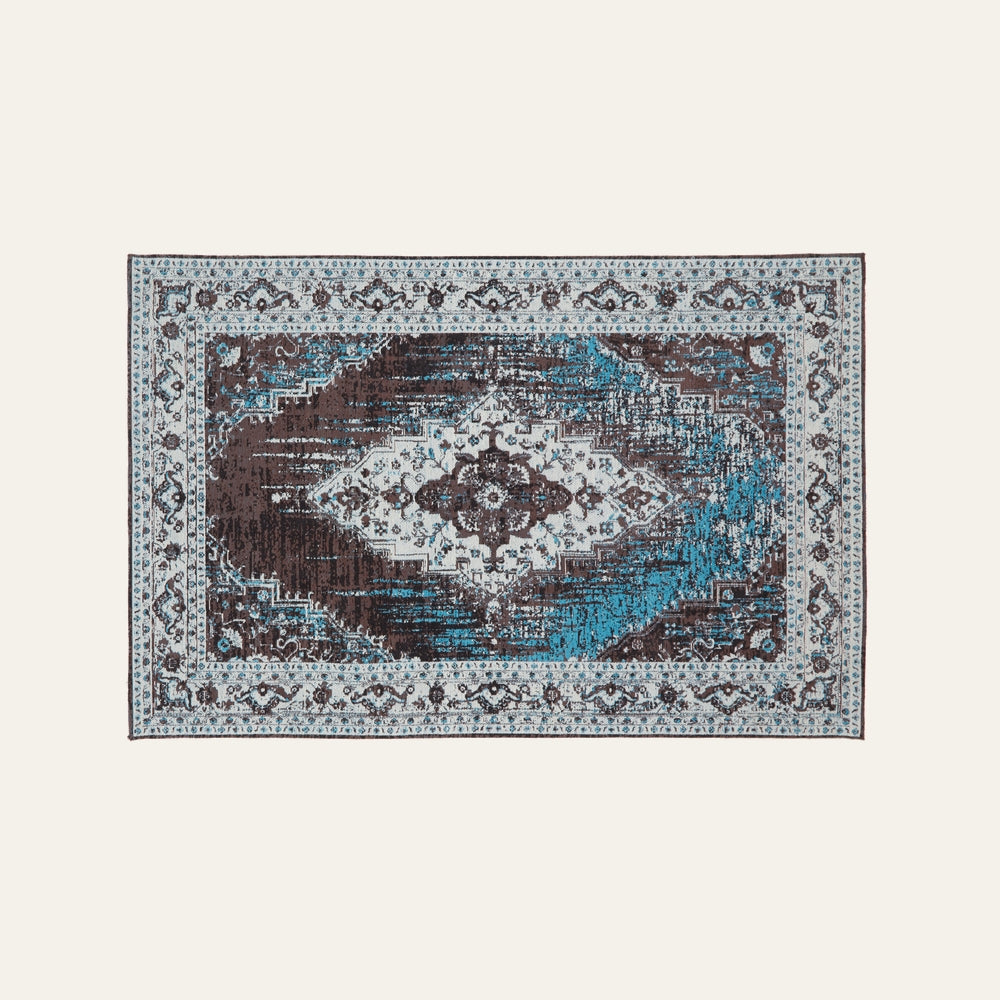 Ezelle Rug | Morvi Rug: rectangular rug with distressed central medallion and ornate border in teal, chocolate brown, and ivory