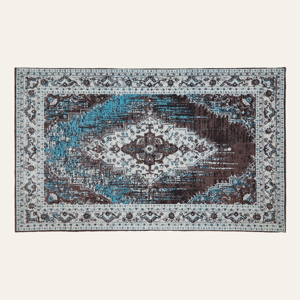 Ezelle Rug | Morvi Rug — rectangular rug with distressed vintage medallion pattern in teal, brown, and cream