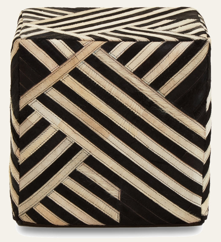 Ezelle Striped Leather Pouffe — square leather pouffe covered in black and natural diagonal striped hair-on-hide panels with visible stitching