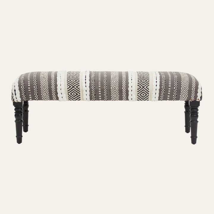 Fenlor Open Frame Bench with gray and white geometric woven fabric seat, cream braided trim accents and black turned wooden legs