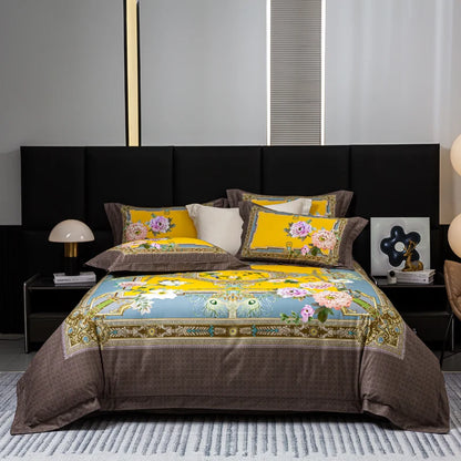 Decorative bedspread with floral patterns on a bed in a bedroom setting.