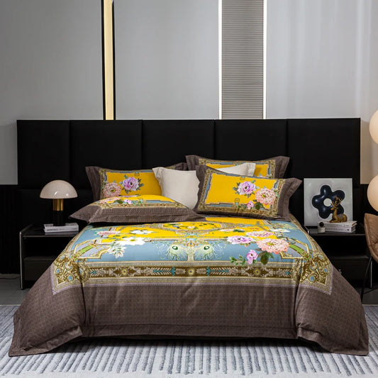 Decorative bedspread with floral patterns on a bed in a bedroom setting.