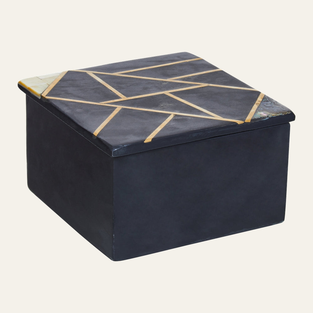 Hadrin Slate Trinket Box — square matte dark slate box with gold-tone geometric inlay on the lid and cream and iridescent shell corner accents