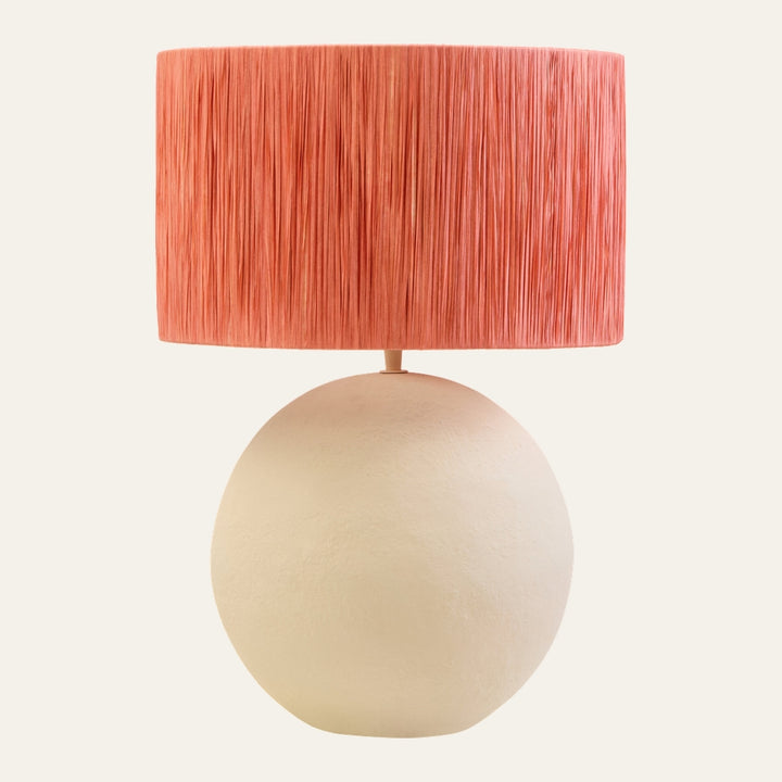 Irdan Table Lamp with textured cream spherical base and coral-pink pleated fiber drum shade