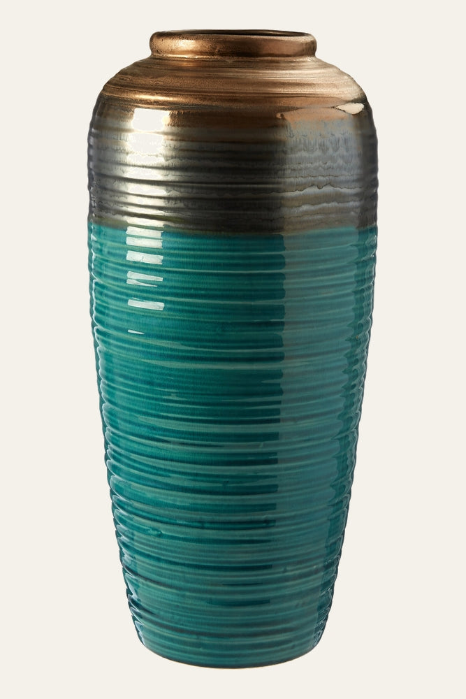 Irisa Ribbed Ceramic Vase — tall ribbed ceramic vase with glossy turquoise body and metallic bronze-gray neck.