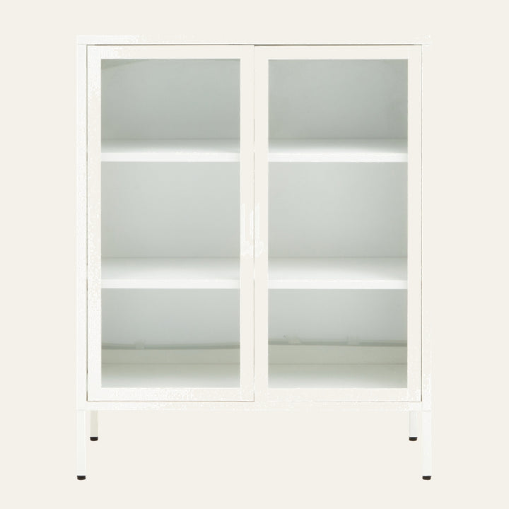 Leven Cabinet — white glass-front cabinet with two doors, two interior shelves and slim white metal legs with glossy finish