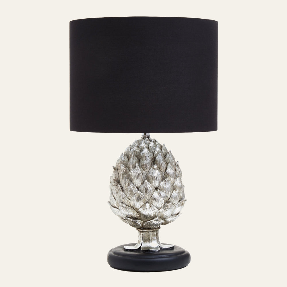 Orelia Artichoke Table Lamp with silver-finished artichoke-shaped base, black round base and black fabric drum shade