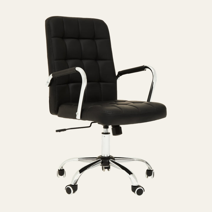Oren Tufted Desk Chair — black tufted padded back and seat with slim padded armrests, chrome curved arms and five-star chrome base with casters and visible height-adjustment lever