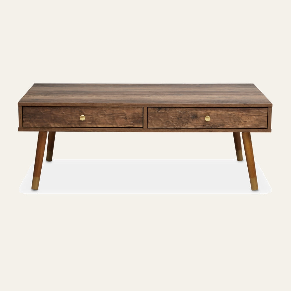 Orena Wood Coffee Table — rectangular walnut-finish wood top with two front drawers featuring round brass knobs, angled tapered legs with brass-capped feet.