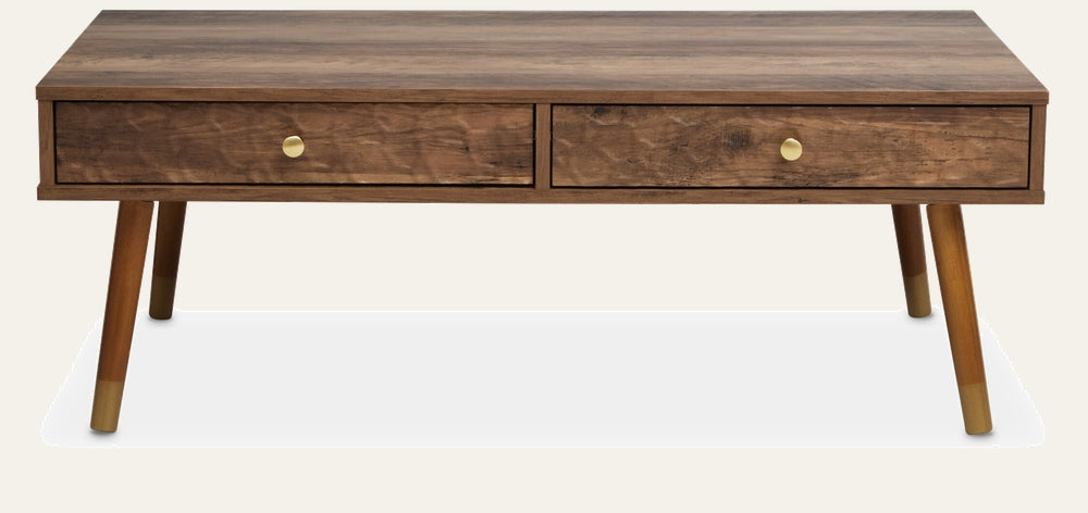 Orena Wood Coffee Table with rectangular wood top showing rich wood grain, two front drawers with round brass knobs, tapered legs with brass-capped feet and warm brown finish.