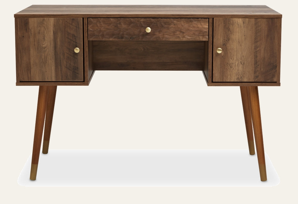 Orena Wood Storage Desk in warm brown wood grain with central drawer and two side cabinet doors, tapered mid-century legs with brass-capped feet and round brass knobs.