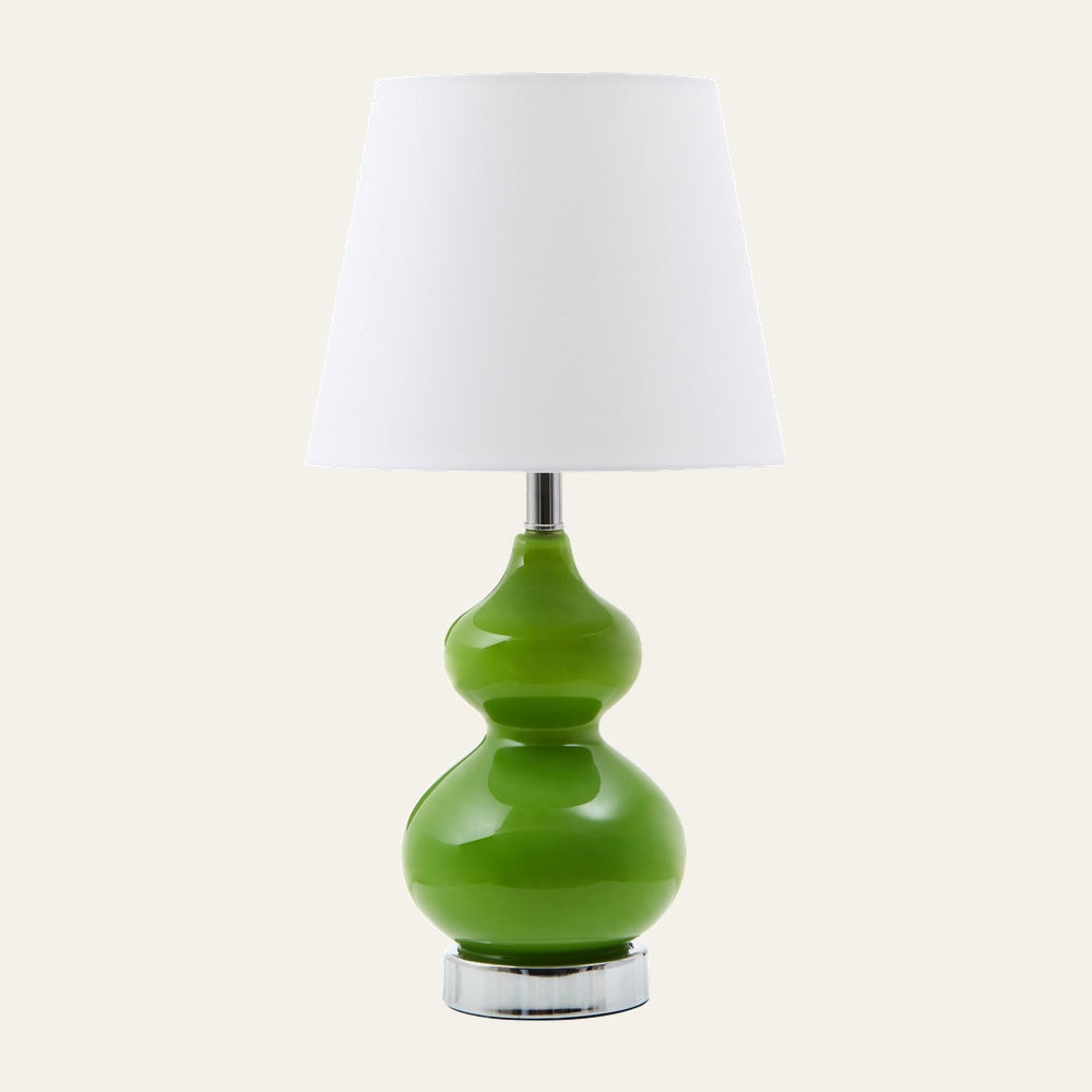 Oriana Glass Shade Table Lamp with white tapered fabric shade and glossy green double-gourd glass base on a chrome round pedestal