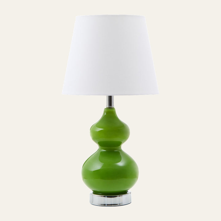 Oriana Glass Shade Table Lamp with white tapered fabric shade and glossy green double-gourd glass base on a chrome round pedestal