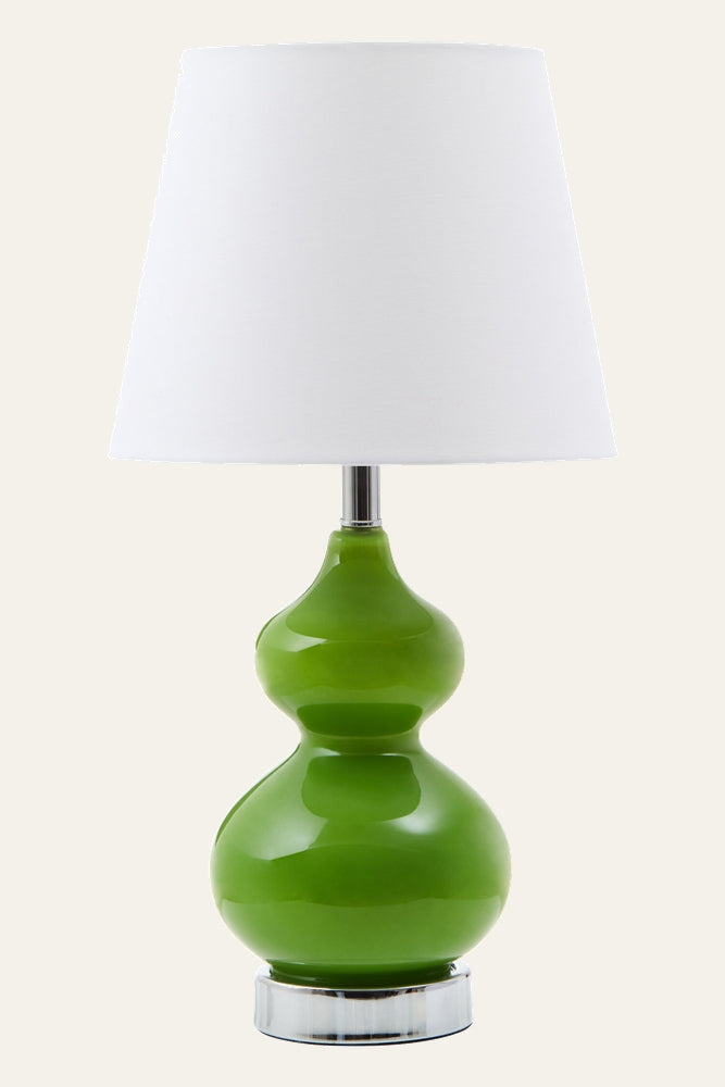 Oriana Glass Shade Table Lamp with glossy green double-gourd glass base, chrome neck and clear round base, topped by a white tapered fabric shade