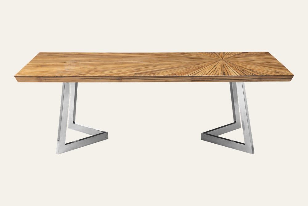 Orlina Bamboo Coffee Table with rectangular natural bamboo top showing a radial sunburst veneer pattern and angled polished stainless steel triangular legs