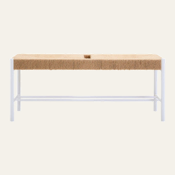 Quildor Open Frame Bench with rectangular tan woven seat featuring a small center groove atop a white open metal frame