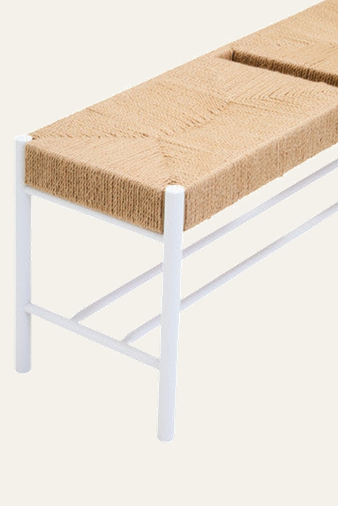 Quildor Open Frame Bench with rectangular woven natural-fiber seat and white tubular metal frame and crossbars