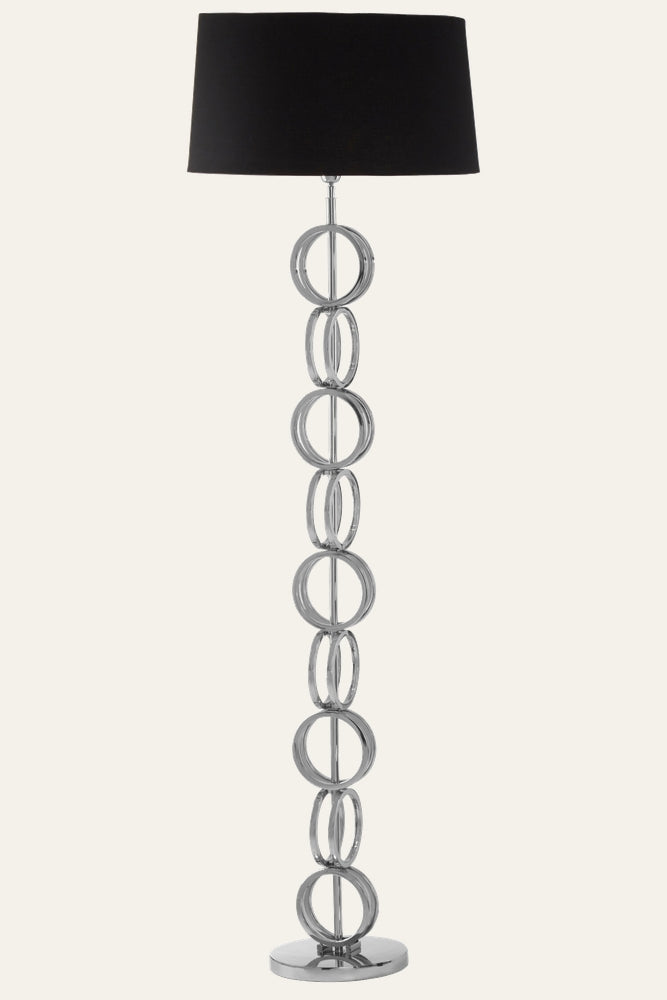 Selva Multi Ring Floor Lamp with stacked polished chrome rings column, central chrome rod and round chrome base, topped with a black fabric drum shade