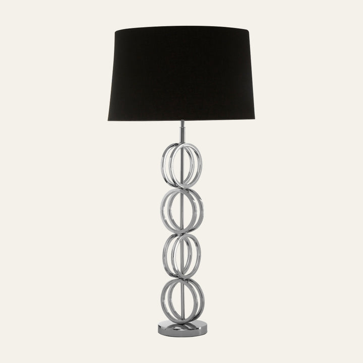 Selva Multi Ring Table Lamp with stacked polished chrome ring base and black fabric drum shade