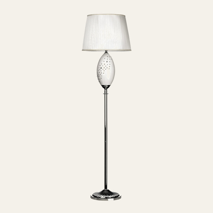 Serelle Floor Lamp with white pleated fabric shade, oval dotted glass accent, polished chrome stem and fluted round base