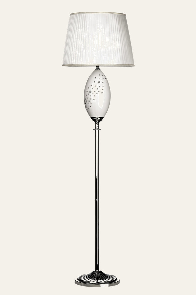 Serelle Floor Lamp — white pleated fabric shade with metallic trim, glossy white oval glass body studded with clear crystal accents, slim polished chrome pole and fluted chrome round base