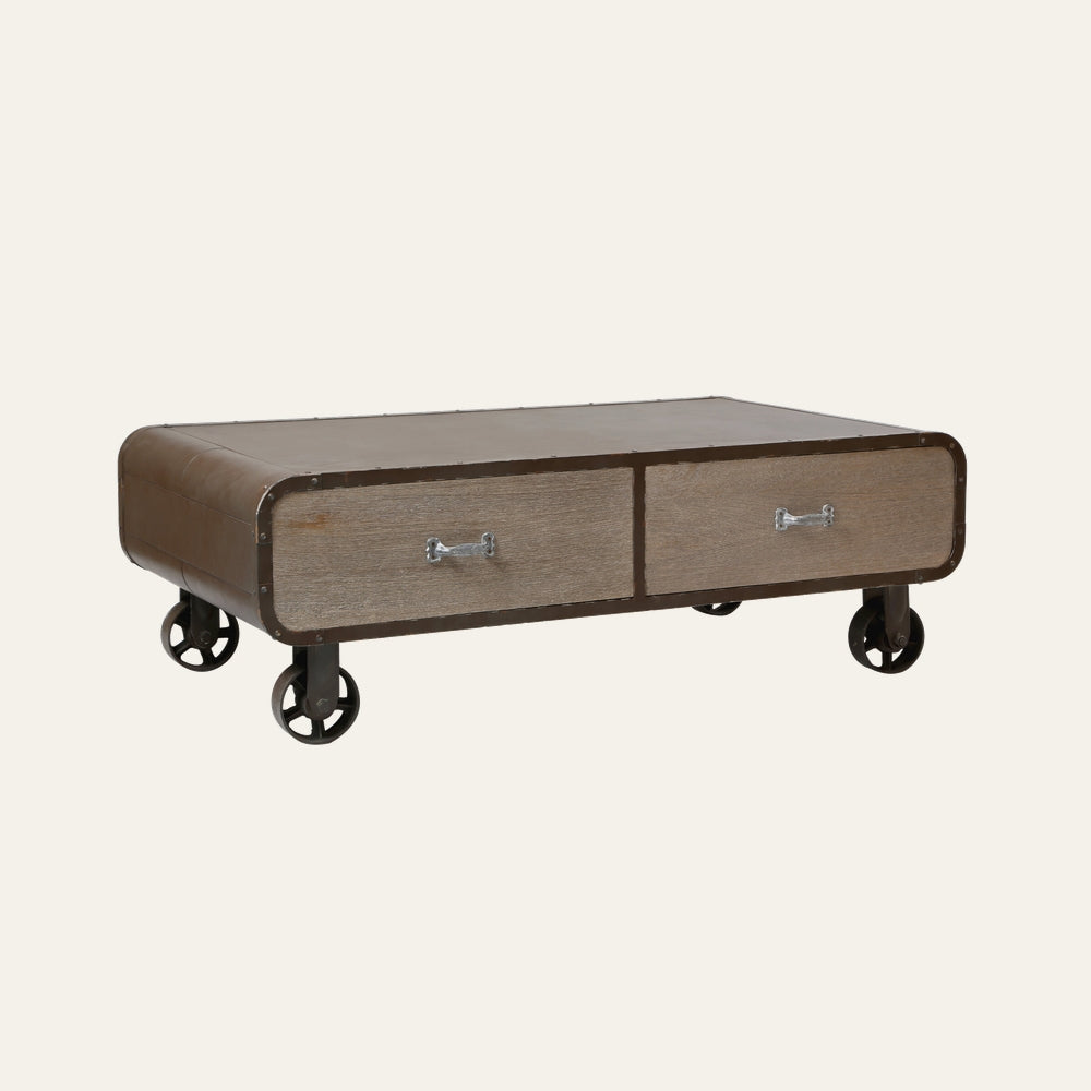 Stellan Two Drawer Coffee Table with rounded brown metal frame, two weathered wood drawer fronts with silver handles and industrial caster wheels