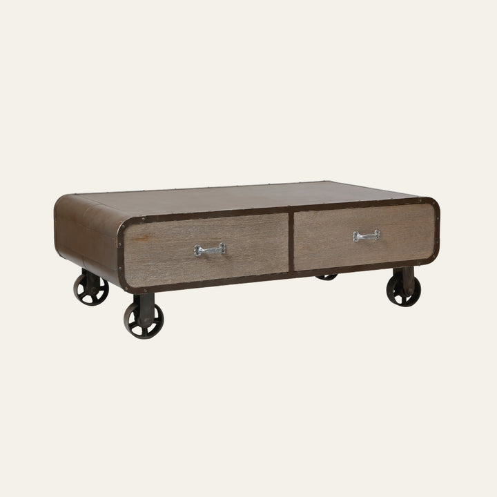 Stellan Two Drawer Coffee Table with rounded brown metal frame, two weathered wood drawer fronts with silver handles and industrial caster wheels