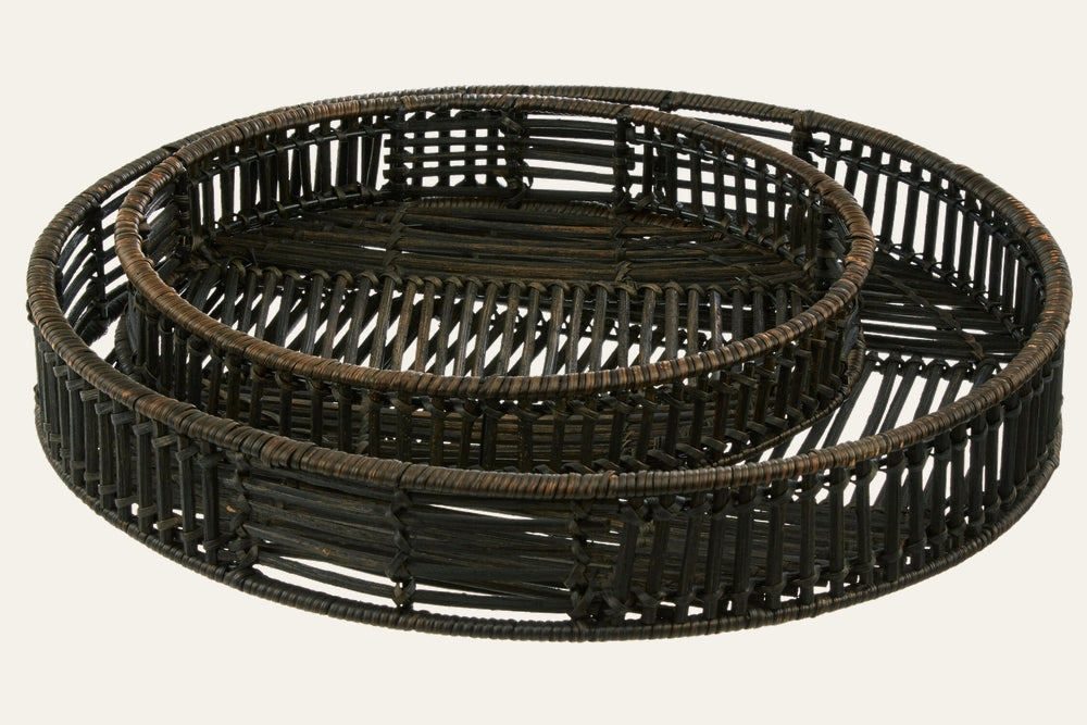 Tavren Black Rattan Tray Set: two nested round trays in black rattan with open woven sides and low raised rims