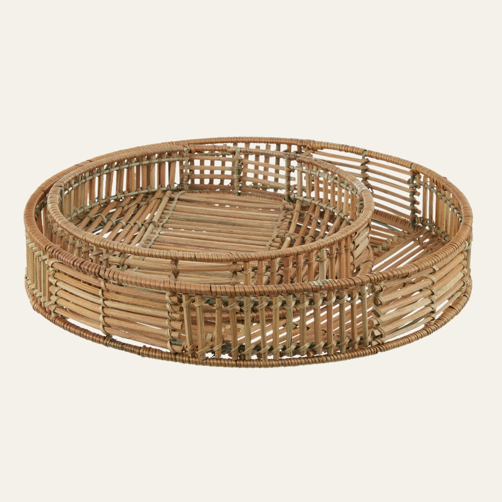 Tavren Natural Rattan Tray Set: two round natural rattan trays with open-slat woven sides and flat woven bases, shown nested