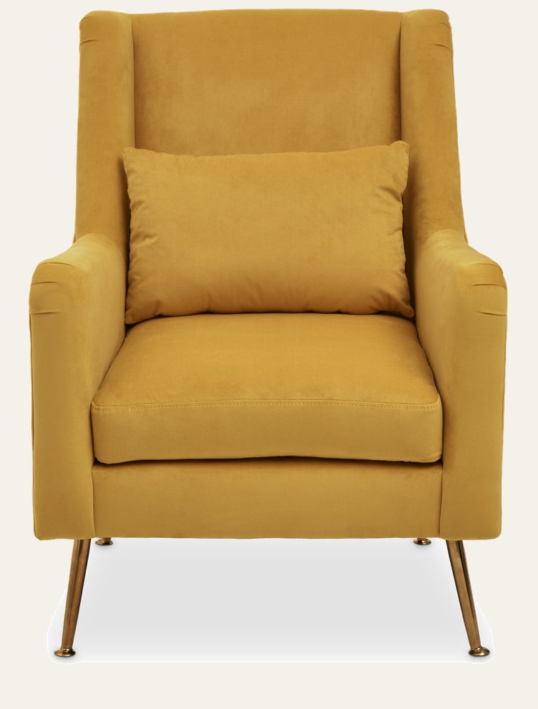 Varela Velvet Chair — mustard yellow velvet high-back armchair with loose seat cushion and lumbar pillow, slim tapered metal legs with brass finish.