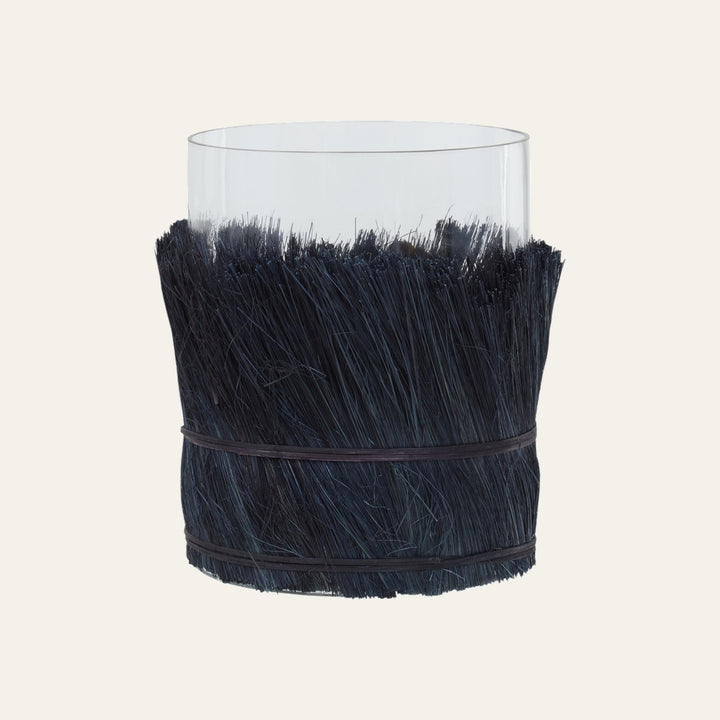 Velora Candle Holder with clear glass cylinder and dark navy bristle grass wrap secured by two thin bands