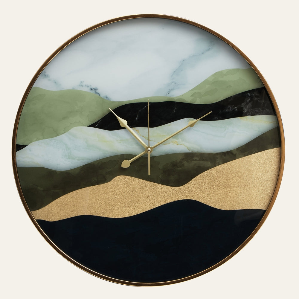 Xandor Glass Wall Clock with round glass face, thin gold metal frame and gold hands, abstract layered waves in marble white, sage green, black, navy and metallic gold